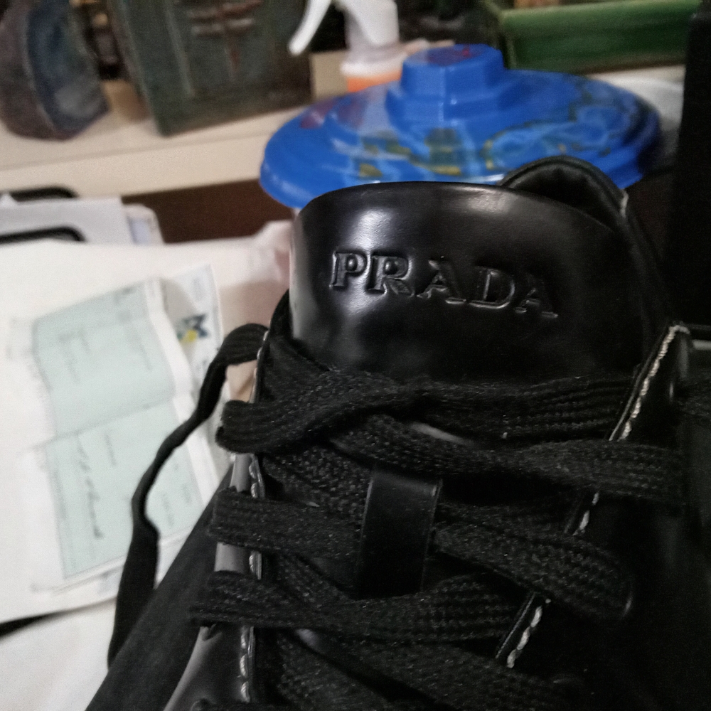 Prada Black Sneakers with Glossy Finish and Metallic Accents - Picture 7 of 7